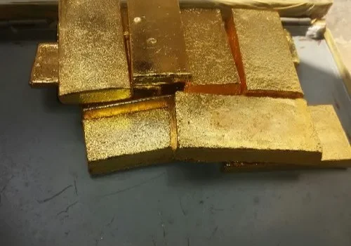 Image of 18K gold bars stacked – “Certified 18K gold bars 75% pure gold for investment and jewelry